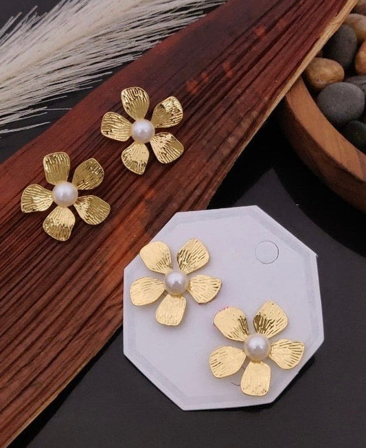 Floral white stone studs Gehnacollections